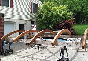 The arches were fabricated by a local millwork shop (taguelumber.com) from western red cedar. 