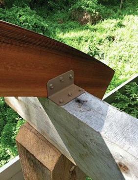 The arches are fastened to the beams with heavy-duty angle brackets. 