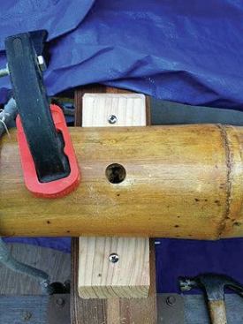 I joined the rafters to the arches by first cutting an access hole through the top, and then running a self-tapping screw through the lower section and into the arches. I placed 1½” cedar stops on either side of the rafters to help hold them in place.