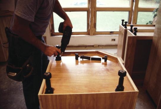 Some adjustable leveling legs, such as these from Camar (camar.it), come with clips to support toe-kick panels.