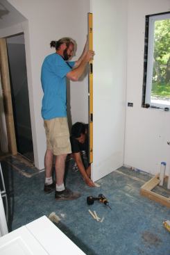 For a clean appearance, scribe extra-deep and extra-tall full-height panels to the floor and wall.