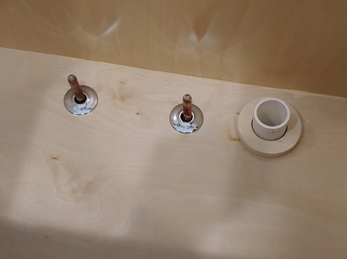 Sometimes, the best thing to do in the case of a misdrill is to fabricate an escutcheon, which the author did here with a piece of 1-by and a couple of hole saws. He trimmed it down in the planer to about 3/8 inch and zapped it with clear coat. Problem solved.