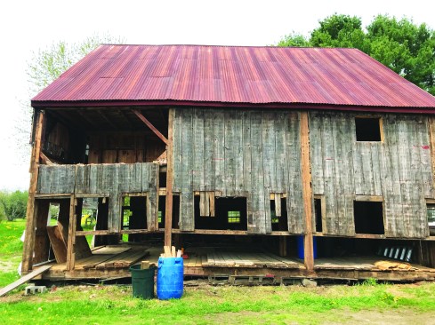 The barn’s original frame and board siding had more charm than integrity.