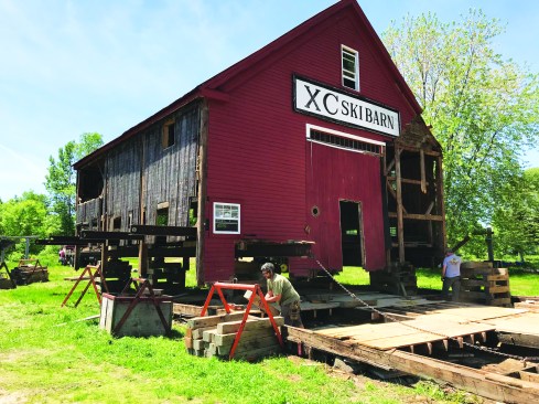 To expose the foundation, the barn was jacked up ...