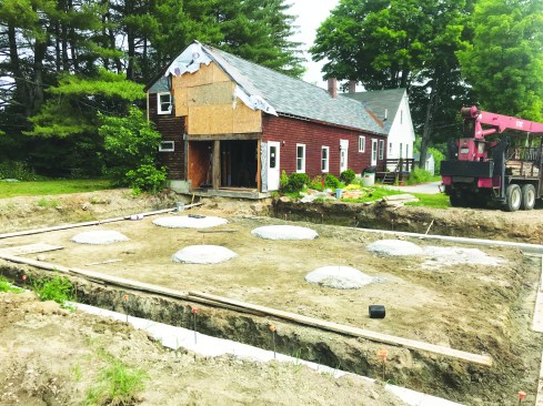 Thick concrete pads were placed to support the interior post ends.