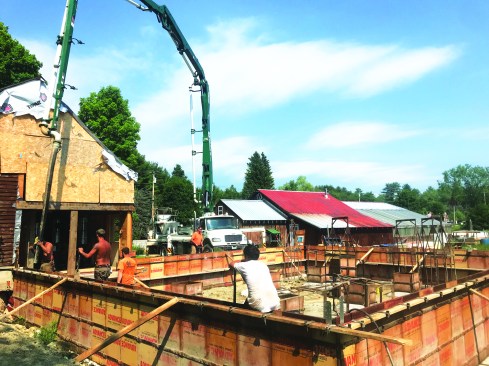 A concrete perimeter foundation was placed to elevate and support the walls.