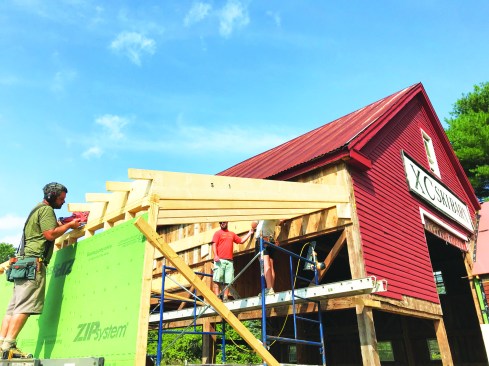 A shed addition adds to the building’s volume with modern insulated construction.