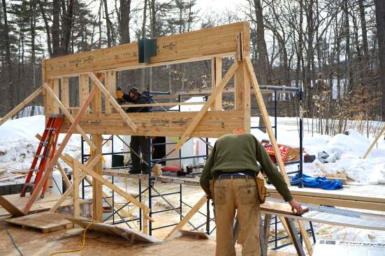 The framed-in window opening with heavy beams above and below and hanger installed sits ready for its girder.