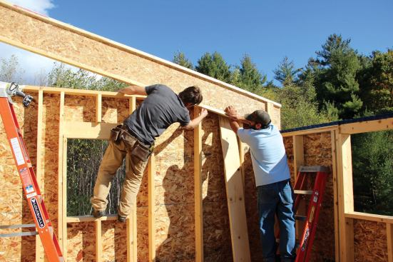 The wall was scribed to match the gable rafter's slope.