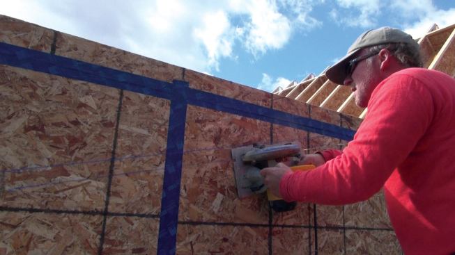 After the scribed line was transferred to the outboard face of the wall, the top of the wall was trimmed to match the slope of the gable rafter.
