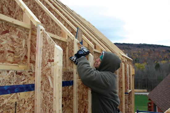 The built-out wall I-joists also help address wind uplift because they are screwed into both the wall and the roof rafters.