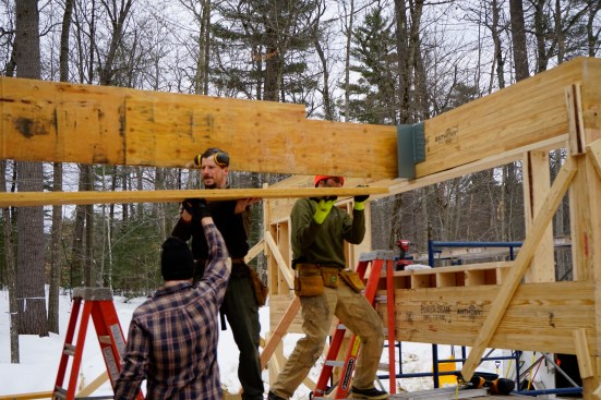 Laminated veneer lumber (LVL), like the structural beam being installed here, is stronger than comparably sized sawn lumber because any natural defects like knots and splits are only one ply deep.
