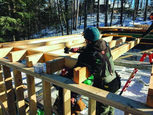 Timber framer Rusty Partridge supplied precut timbers, routed out for wiring chases and electrical boxes.