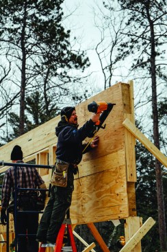 Then they nailed plywood sheathing onto the face of the wall to stiffen the structure.