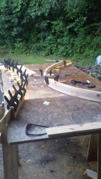 To speed production, the author assembles multiple bending jigs and bends as many rails at a time as he can. 