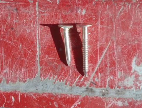 We nail-off the flange with 1 1/4-inch stainless steel ring-shank coil gun roofing nails, which provide considerably more holding power than the cheaper smooth-shank roofing nails.