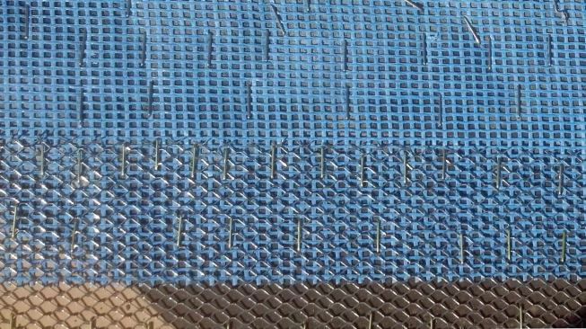We secure the lath and reinforcing mesh with 1-inch-crown stainless steel lathing staples.