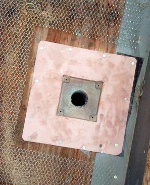 We replaced both of those drains with commercial deck-drain assemblies, like the ones from Thunderbird Products. Then we cut and fit metal lath around the flange without allowing the two metals to touch.