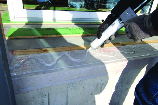 Silicone caulking was used to seal the door sill to the Fentrim membrane.