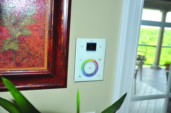 The basement panel is connected to a touch-screen DMX controller mounted in the living room.