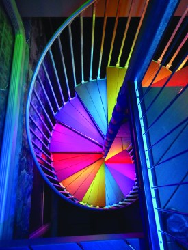 LED strips tucked underneath the nosing of each tread illuminate the staircase.