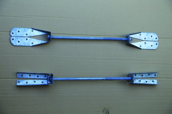 The two most common 1,500-lb. deck lateral-load ties are the Simpson Strong-Tie DTT2 (top) and the MiTek/USP DTB-TZ (bottom). Two are needed per connection, along with a 1/2-inch-diameter bolt or threaded rod, and structural screws to mount the hardware to the framing.