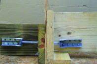 When deck and house joists are parallel, screw a metal tie to the side of a house joist and another to a deck joist with structural screws.