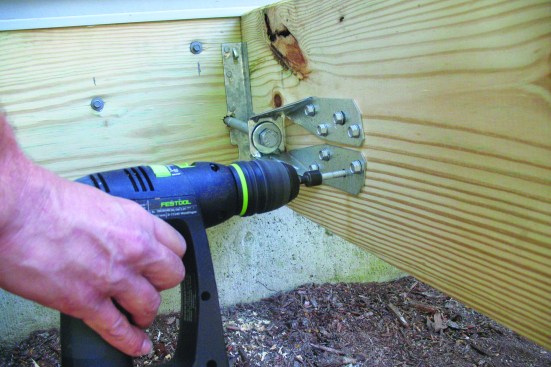 Drill a hole for a 1/2-inch-diameter connecting rod, and bolt the two ties together.