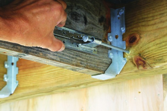 Position it on the deck joist.
