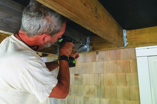 When installing the SST DTT1, slip the plate screw through the hole in the tie before driving it to the proper depth into the house framing.