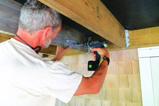 Then fasten the tie to the joist.