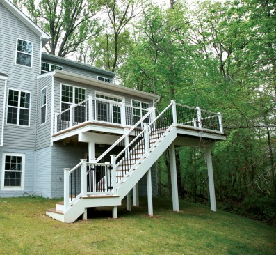 A SpaceMaker deck is ready for phase two: a patio and hot tub on the lower level. Deck framing needs to be sloped with at least a 1/8-inch-per-foot pitch for drainage, a consideration when you’re retrofitting an existing deck with a waterproof decking product.