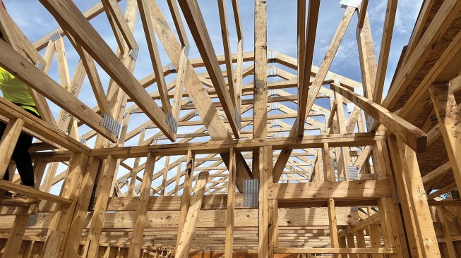 Check for level at every level. An out-of-level floor has telegraphed all the way to the top wall plates, resulting in roof trusses that have no bearing.