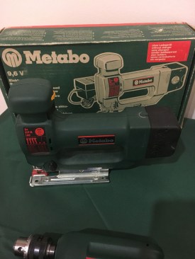 A table setup outside of the event conference room displayed earlier versions of come current products. Here, Metabo's cordless 9.6V barrel grip jigsaw. It had 4 stroke settings, a dial to adjust the speed, and a variable speed trigger. The new version of this, STA 18 LTX 140 , still has 4 stroke settings, a variable speed trigger, and speed dial. But at 6.4 lbs, including the battery, we're guessing it's considerably lighter than the 9.6V showed here.