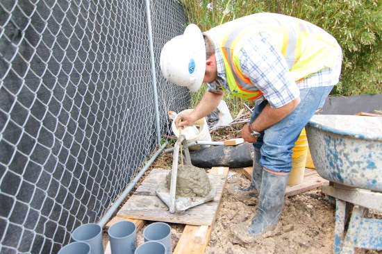 The engineer was kept busy throughout the process, periodically evaluating each truckload of concrete.
