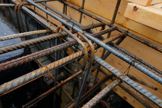 The rebar running through the beams interlocked with the slab reinforcing
and with the pier reinforcing.