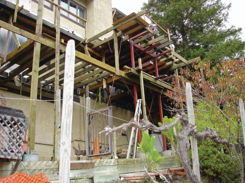 A three-story steel moment frame reinforces the deck framing against lateral loads, and helps support some of the framing. The frame was welded together on site from 6-inch by 6-inch steel columns and 6-inch by 8-inch steel cross members.