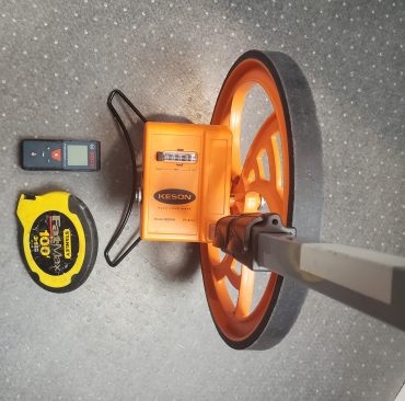 The author’s tools: laser measure, measuring wheel, and long (100-ft.) tape measure.