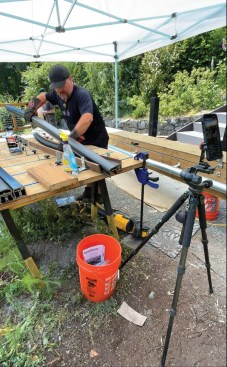 Finally, I enlisted the homeowner’s help to fabricate the custom-curved TimberTech Radiance railings. I heated the rails with heat blankets, then clamped them to a form that I had set up on a work table that matched the curve of each section of stair.