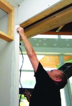 With the compound shaped to his liking, he installs a No-Coat 450 Flex corner
bead, pressing it firmly into the compound.