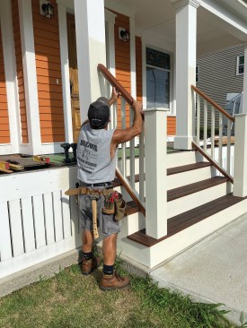 The stair railing has similar details, but the nailers aren’t beveled, and the rail width is 2 5∕8 inches for graspability; the ends of the rails and nailers are notched for drainage.