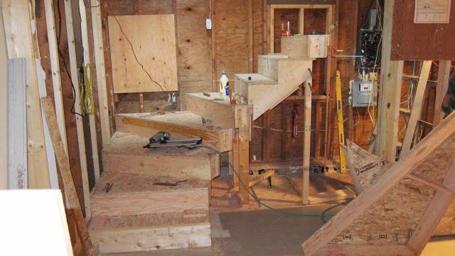 After installing the starter tread—a regular, rectangular box which I leveled—I stacked the four boxes of the lower winder. The two common treads at mid-flight were conventional cut stringers, notched to bear on the winder below. I extended the top tread to support the winder tread above.