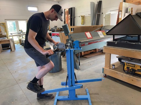 Here, the author demonstrates how he uses his shrinker/stretcher tool to bend metal to a radius