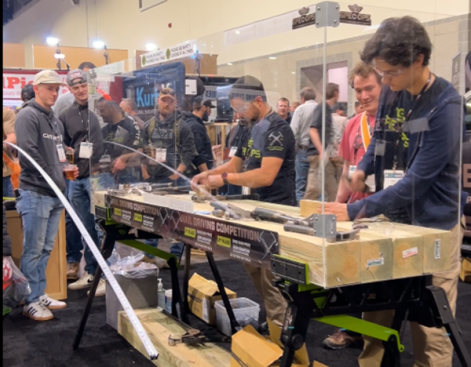 A nail-driving competition on the expo floor exemplifies the high-energy combo of fun and learning to be found at JLC Live. (Photo: Nicole Tysvaer)