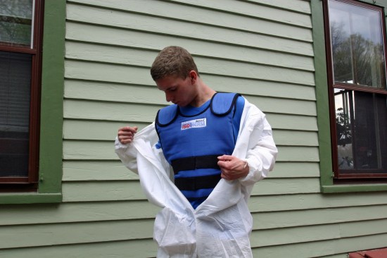 A cooling vest can make the experience of wearing disposable coveralls tolerable, if not enjoyable on a hot summer day.