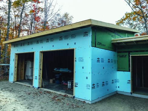 Above, a view of the wall exterior during construction shows the 2-inch layer of XPS foam over ZIP sheathing.