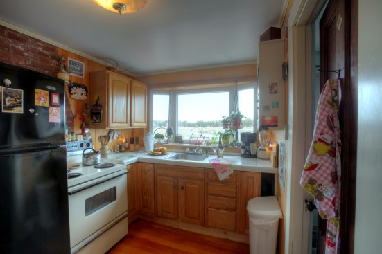 The original kitchen was outdated with full-size appliances and no dishwasher. Smaller appliances and an altered cabinet layout would allow for additional counter space and the inclusion of an 18-inch-wide dishwasher.