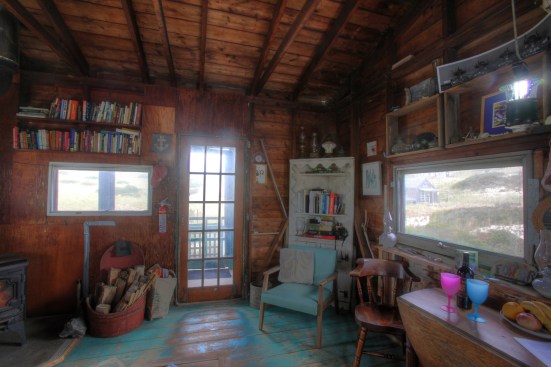 A fifteen light door and wide awning windows let plenty of daylight into this part of the shack.