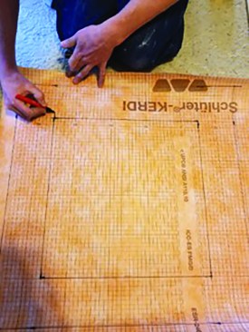 One sheet of Kerdi. The author starts by drawing the back wall of the inset or niche on a piece of Kerdi. He expands that box to include the depth of the inset on all sides and then adds the prescribed 2 inches of overlap as the outside dimensions of the Kerdi paper. For this example, the interior box is 15 inches square; the second box is 23 inches square (2x4 wall with 1/2-inch drywall); and the sheet size is 27 inches square.
