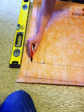 With the perimeters defined, the author then draws a line from the corners of the interior box to the edges of the exterior box to represent either a cutting line or a folding line.